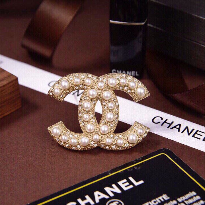 Ch*el brooches